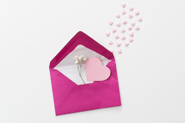 Free photo envelope with paper heart and plant twig