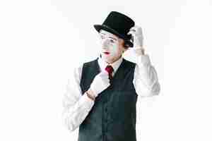 Free photo envious mime fixes his hat