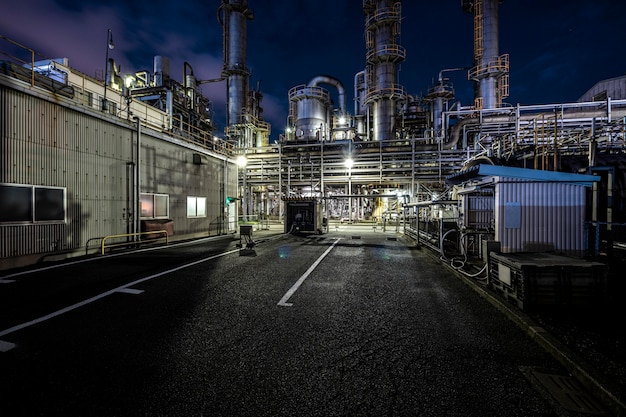 Environmental pollution and factory exterior at night