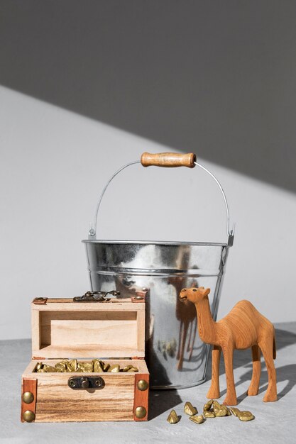 Epiphany day camel figurine with treasure chest and bucket