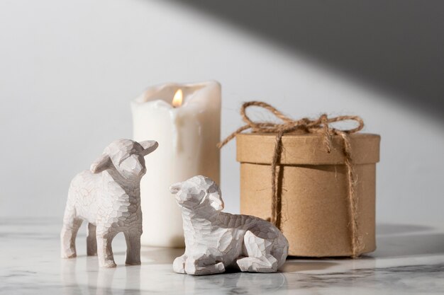Epiphany day sheep figurines with candle and gift box