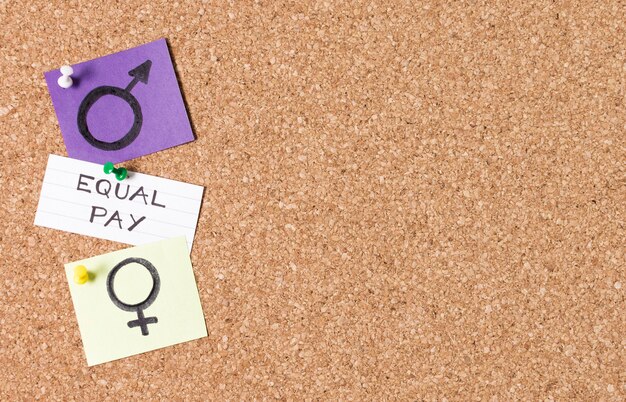 Equal pay between man and woman gender symbols copy space