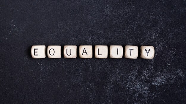 Equality concept written in wooden cubes