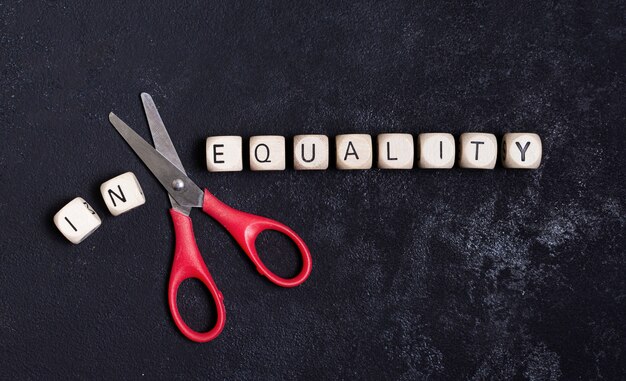 Equality and inequality concept with scissors