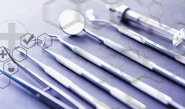 Equipment for the dental office. orthopedic instruments. dental technician with working tools. dentist metal tools.