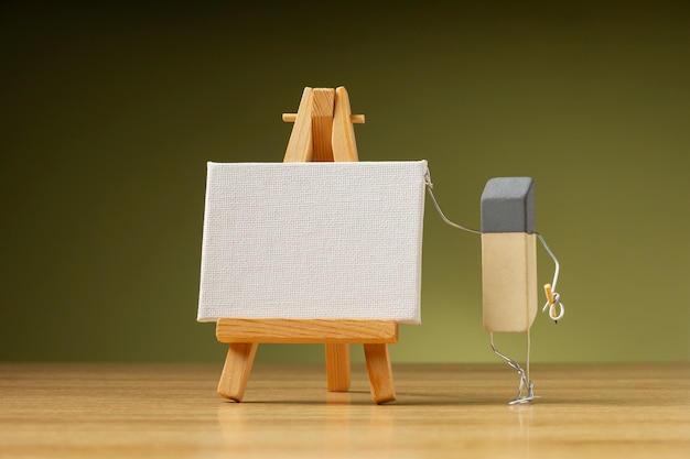 Eraser painting on blank easel still life