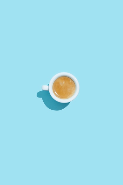 Espresso cup on blue background