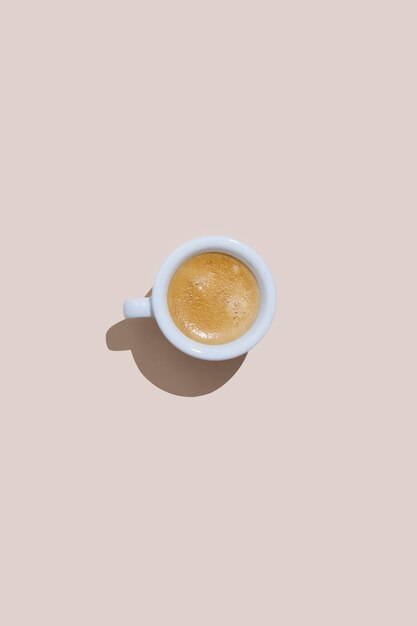 Espresso cup on cream background
