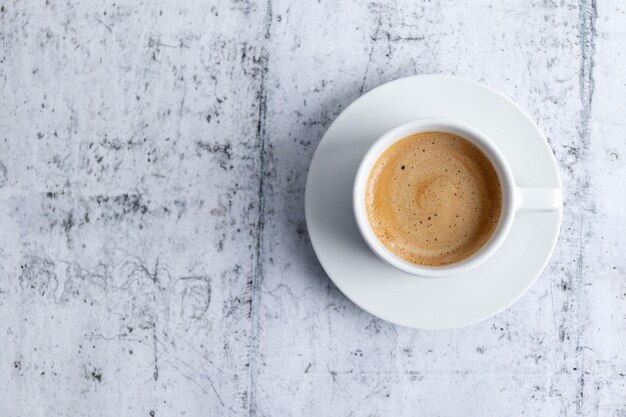 Espresso cup on grey background