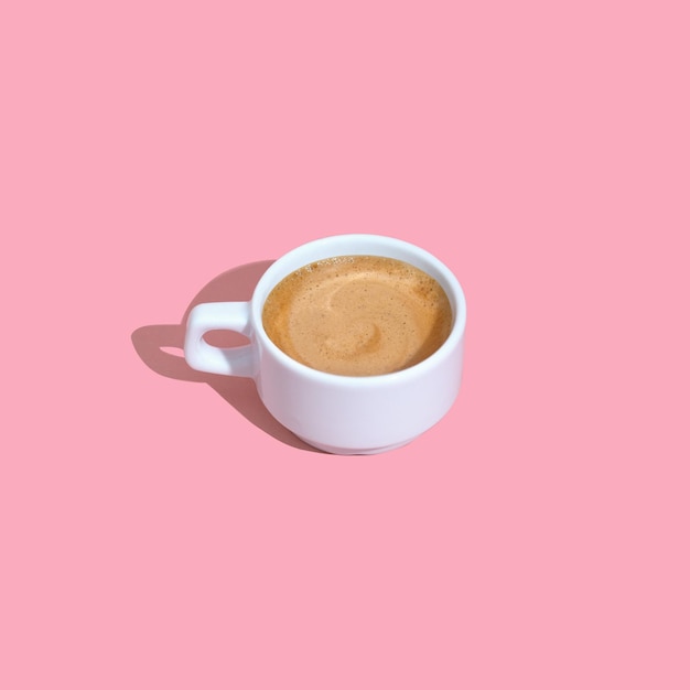 Espresso cup on pink background