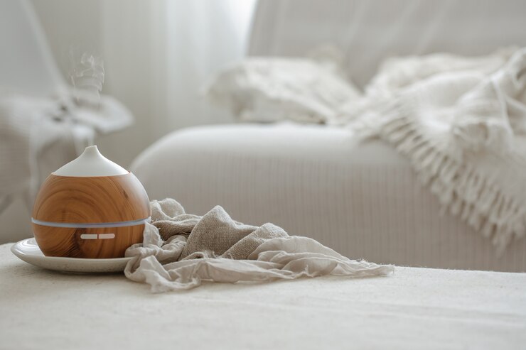 Free Photo essential oil aroma diffuser humidifier diffusing water articles in the air.