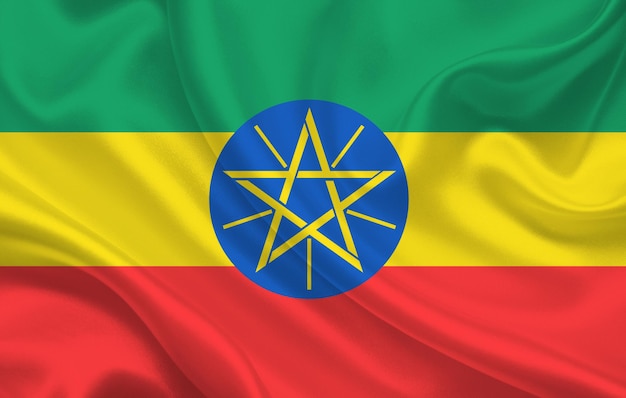 Ethiopia country flag on wavy silk fabric panorama background - illustration