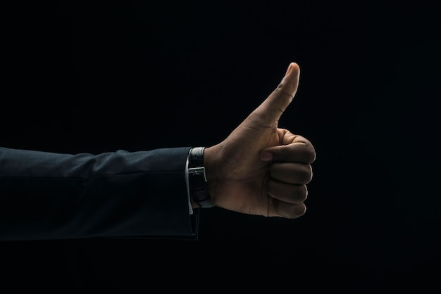 Ethnic businessman showing thumb up