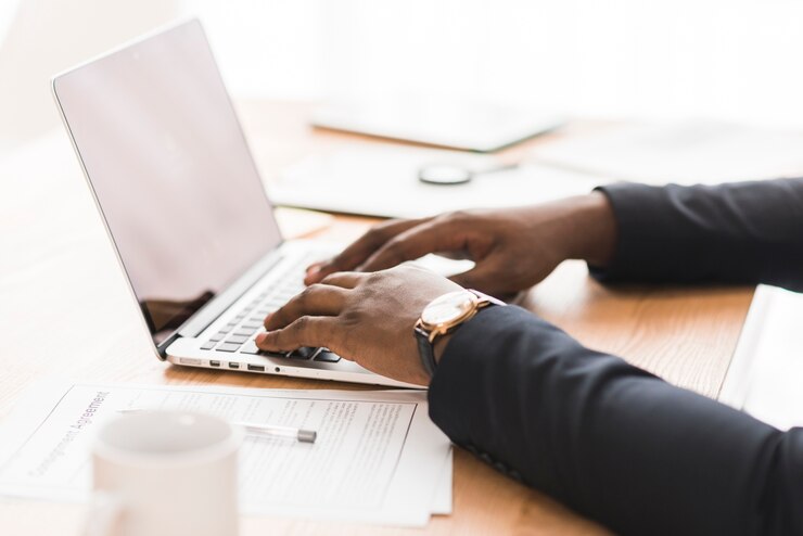 Free Photo ethnic hands typing on laptop