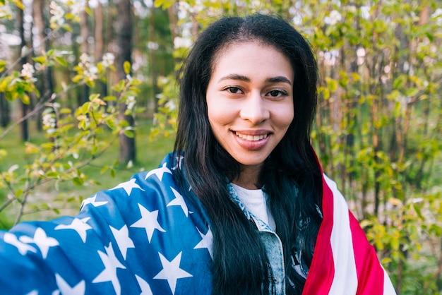 Ethnic woman with American flag