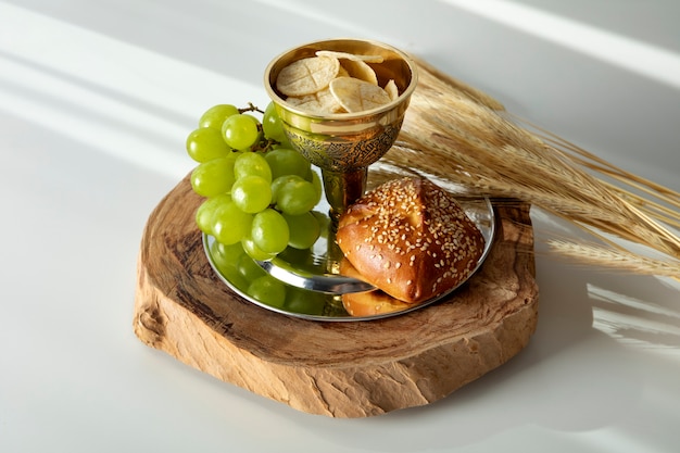 Eucharist with chalice and grapes high angle