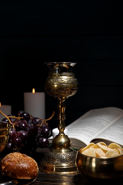 Eucharist with wine chalice and grapes arrangement