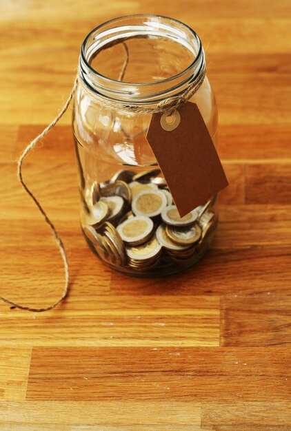 euro coins in a glass jar