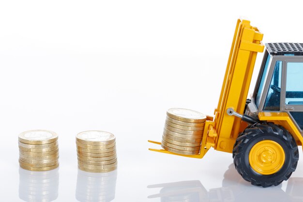 Euro money coins and forklift isolated on white space