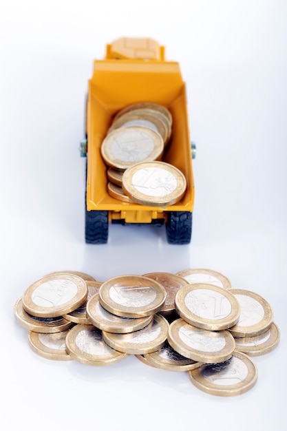 Euro money coins and truck isolated on white space