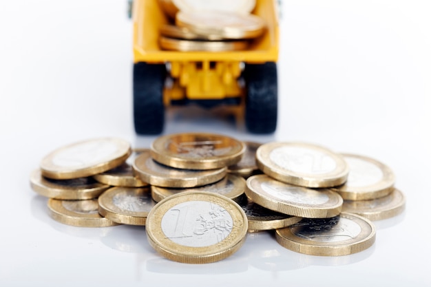 Euro money coins and truck on white space