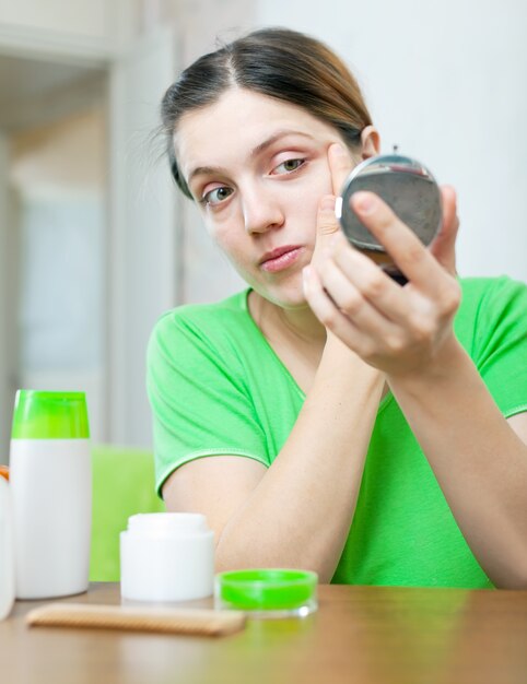 european woman stares on her face