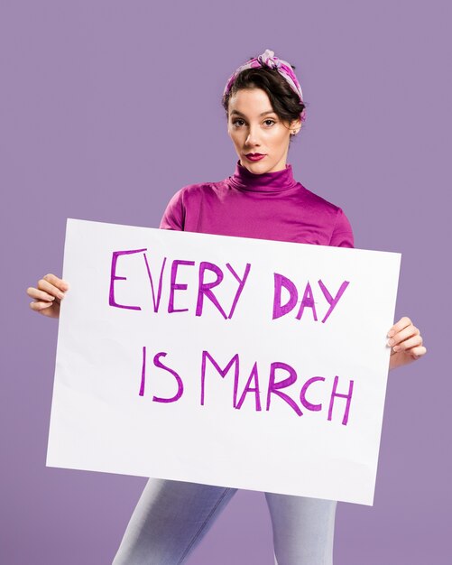 Every day is march cardboard with woman holding the board