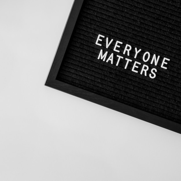 Free photo everyone matters quote on black fabric