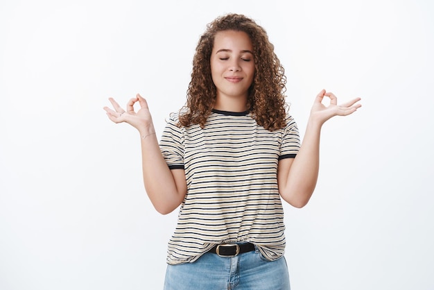 Everything zen Charming relieved relaxed meditating plump girl unbothered smiling closed eyes standing lotus pose reach nirvana breathing practice yoga gain patience courage