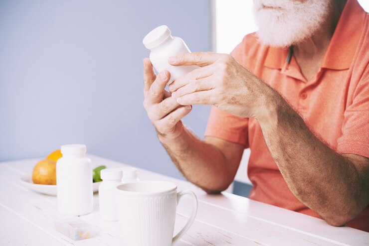Free Photo examining pill bottle