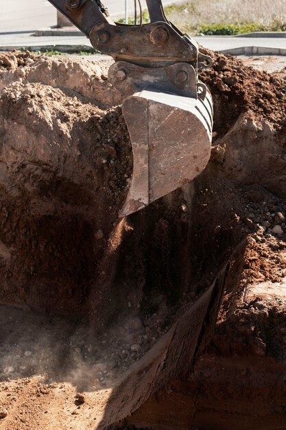 Excavator digging in the ground on day light