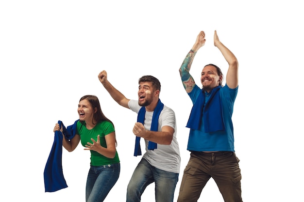 Excellent goal. Three soccer fans woman and men cheering for favorite sport team with bright emotions isolated on white studio background.