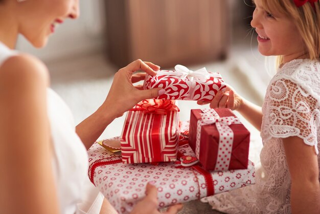 Exchange presents between woman and little girl