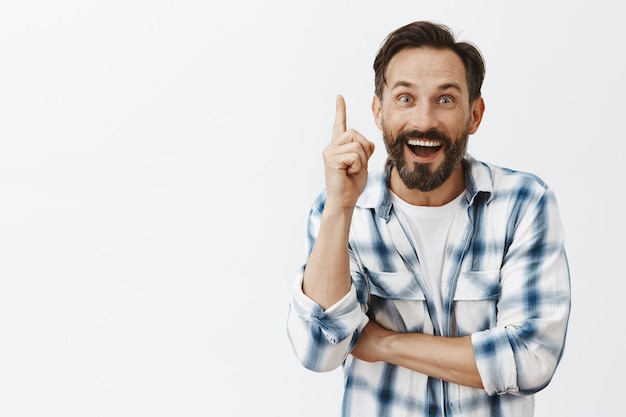 Excited bearded mature man posing