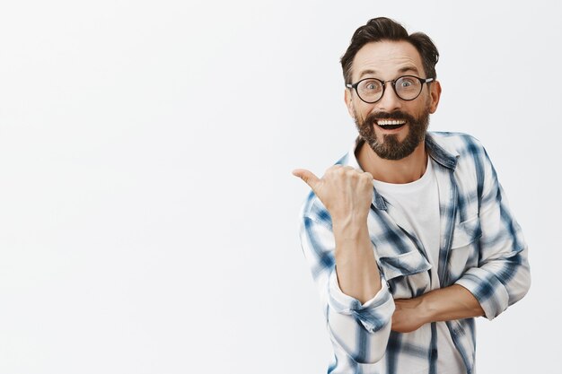 Excited bearded mature man posing