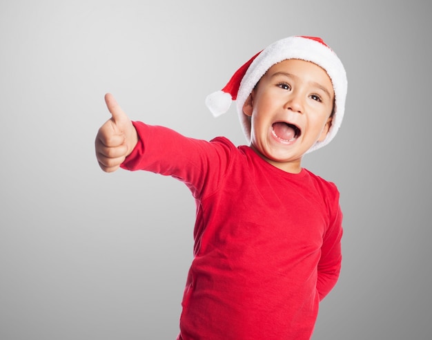 Excited boy with thumb up