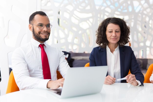 Excited business colleagues discussing deal