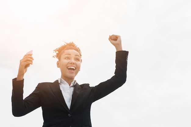 Excited business woman with copy space