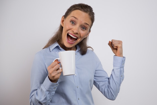 Excited businesswoman celebrating winning