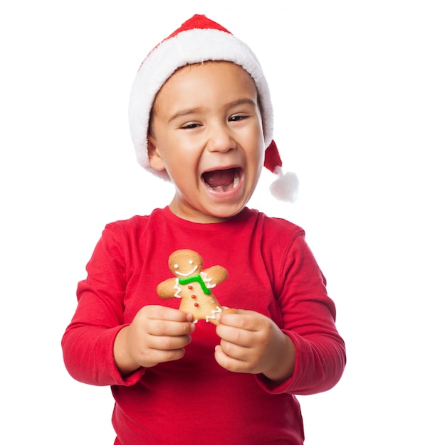 Excited child showing his gingerbread
