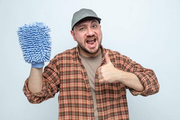 Excited cleaner man holding microfiber cleaning glove and thumbing up 