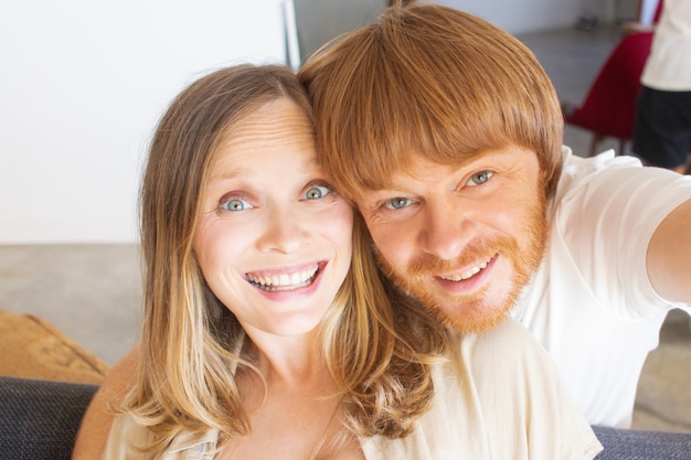 Free photo excited couple having fun at home