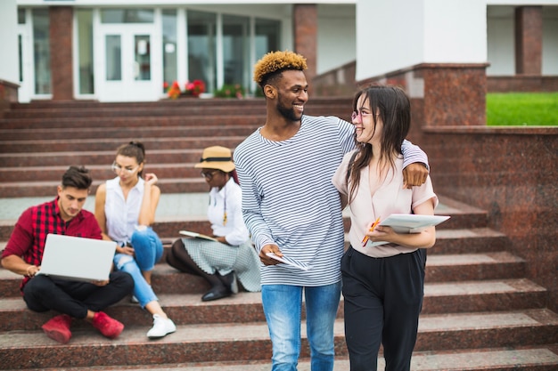 Excited diverse couple of friends posing