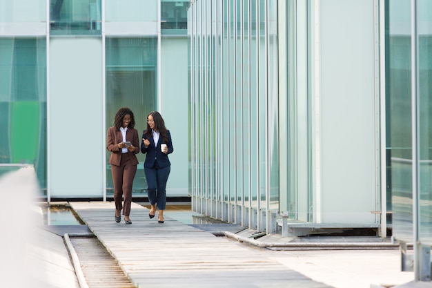 Excited diverse female business colleagues