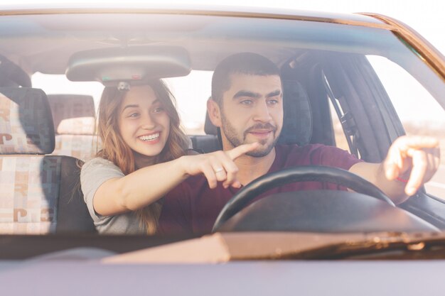 Excited female and male in car