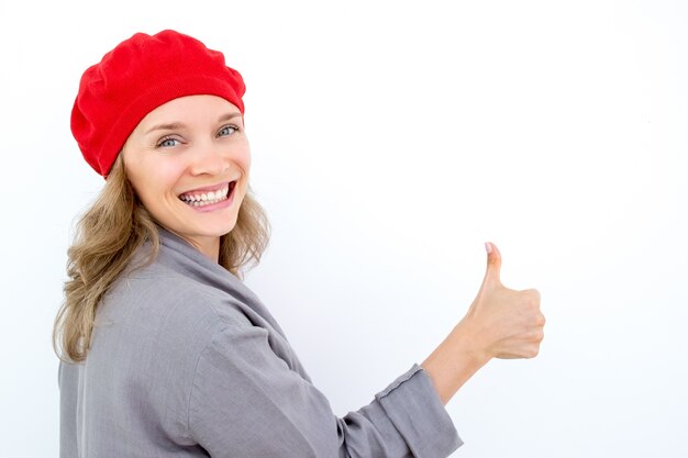 Excited French woman showing thumb up