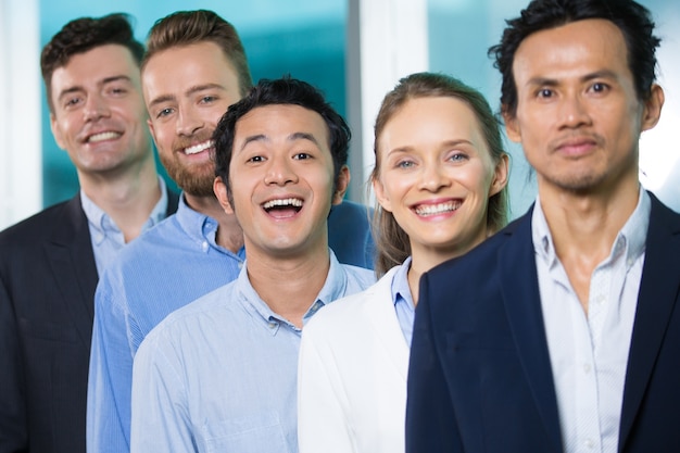 Excited funny Asian manager among colleagues