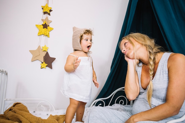 Excited girl looking at mother