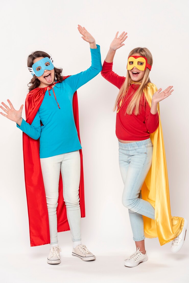Free Photo excited girls with hero costumes