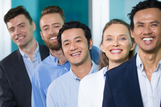 Excited happy business colleagues standing in line